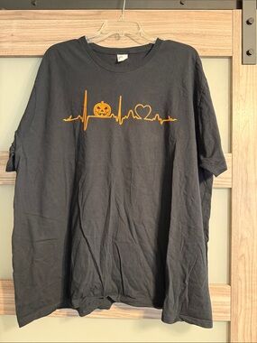 Unisex Nurse Black Tee with Orange Pumpkin Heartbeat Graphic